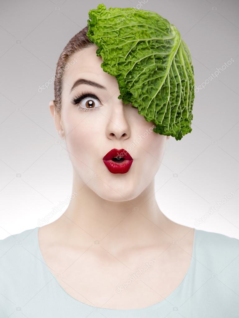 Woman with a cabbage on the head