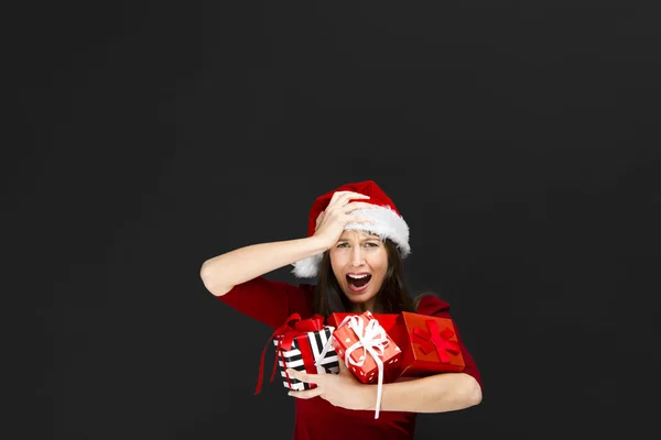 Beautiful woman holding christmas gifts — Stock Photo, Image