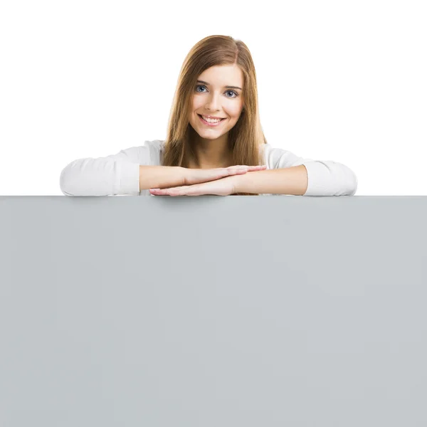 Mulher com uma grande placa em branco — Fotografia de Stock