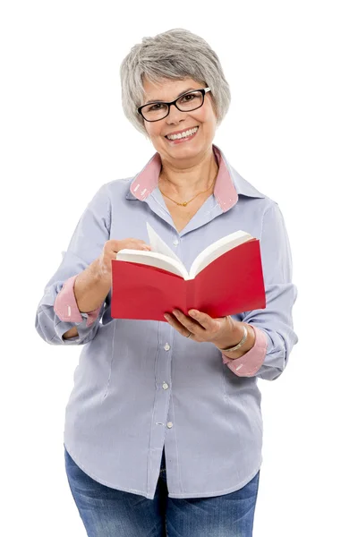 Elderly woman reading a book — Stock Photo, Image