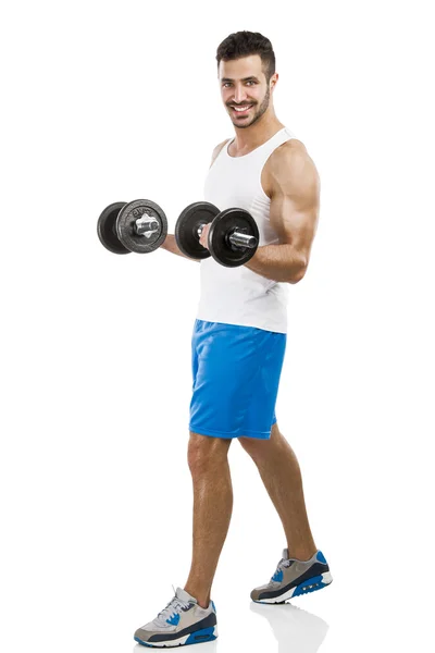 Athletic man lifting weights — Stock Photo, Image