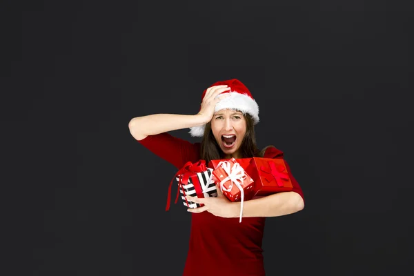 Woman holding christmas gifts — Stockfoto