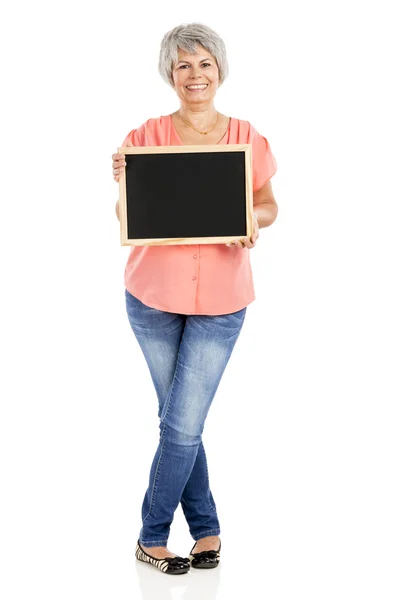 Old woman holding a chalkboard — Stock Photo, Image