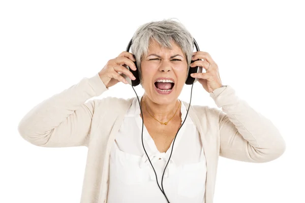 Elderly woman listen music — Stock Photo, Image