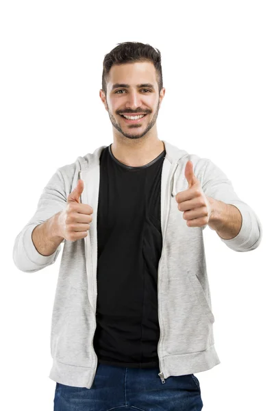 Homem sorrindo com os polegares para cima — Fotografia de Stock