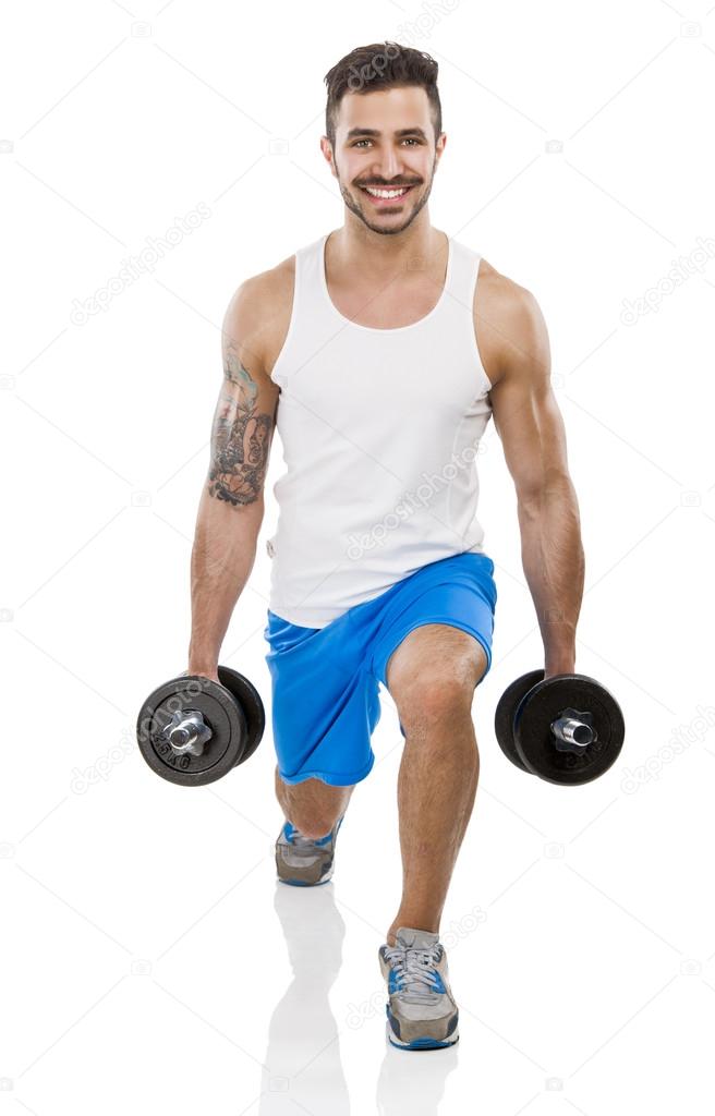 Athletic man lifting weights