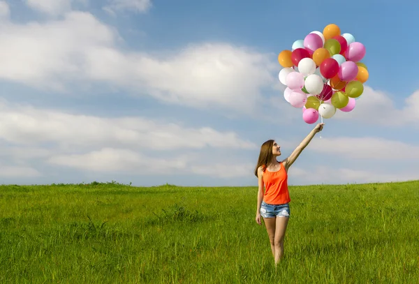 Flicka med ballonger — Stockfoto