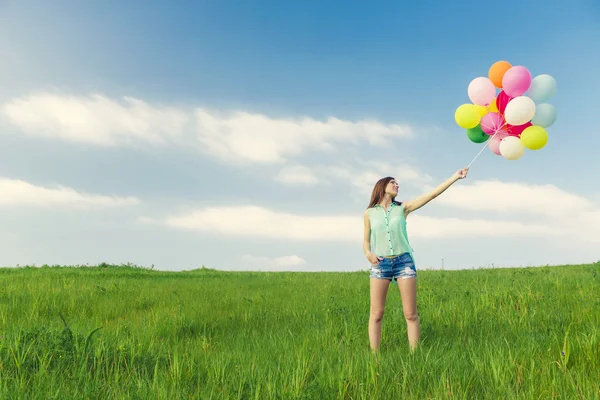 Flicka med ballonger — Stockfoto