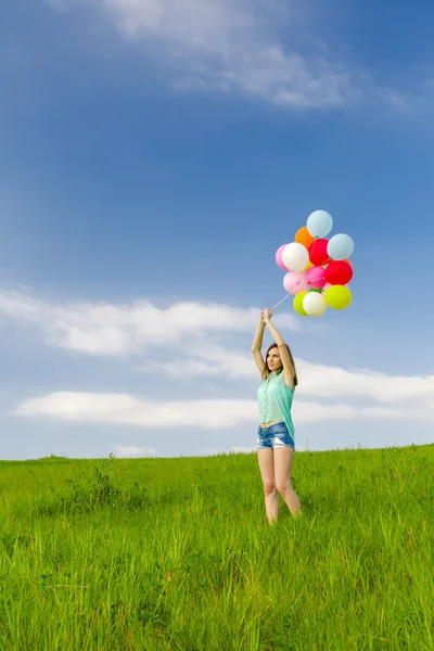 Flicka med ballonger — Stockfoto