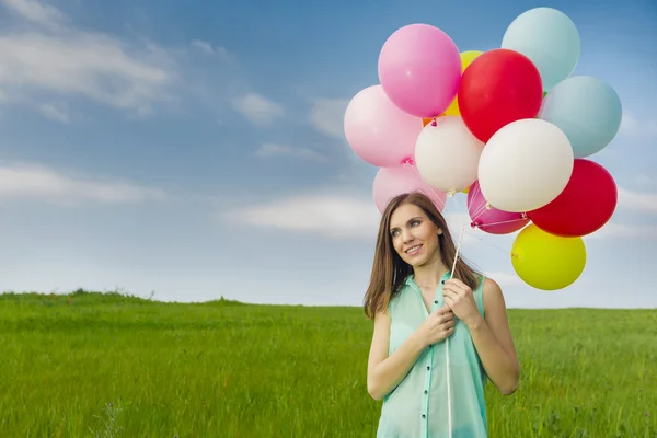 Flicka med ballonger — Stockfoto