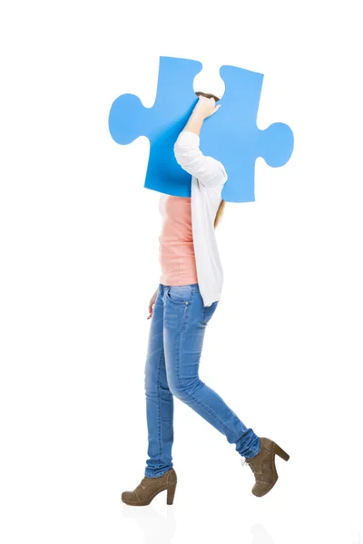 Woman holding a puzzle — Stock Photo, Image