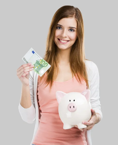 Blonde vrouw met een piggy bank — Stockfoto