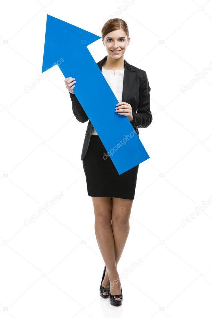 Business woman holding a blue arrow