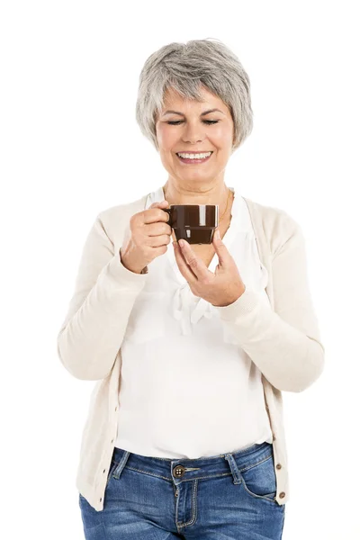 Elderly woman drinking coffee — Stock Photo, Image