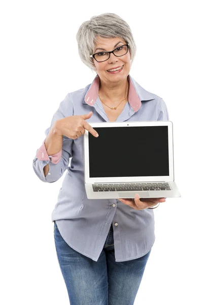 Elderly woman showing  laptop — Stock Photo, Image