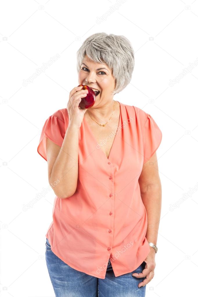 Old woman eating an apple