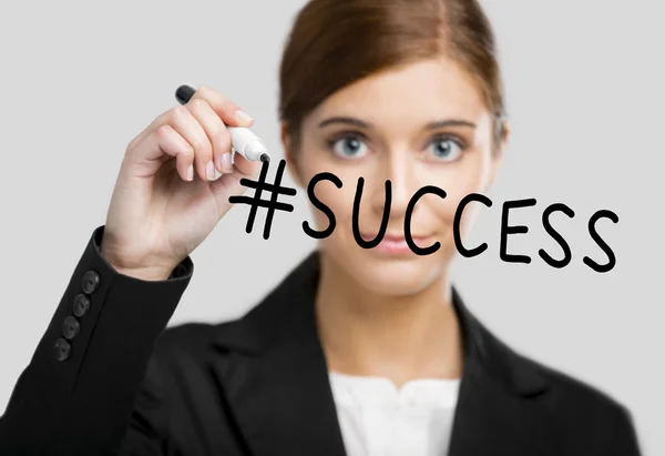 Businesswoman drawing the hashtag success — Stock Photo, Image