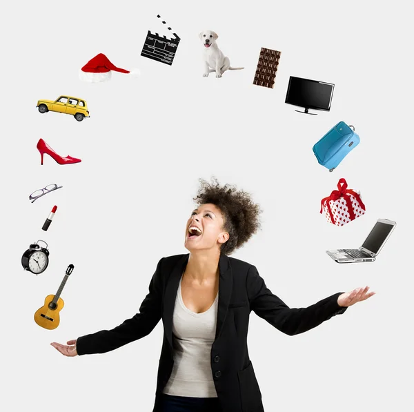 Afro-American woman juggling objects — Stock Photo, Image