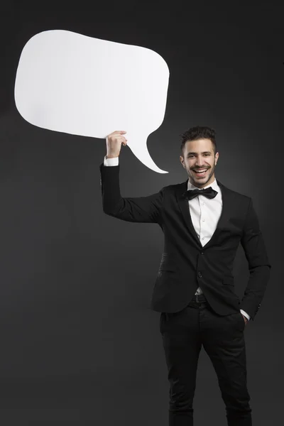 Man holding a speach balloon — Stock Photo, Image