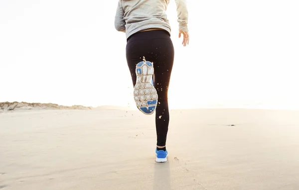 Beautiful woman running — Zdjęcie stockowe