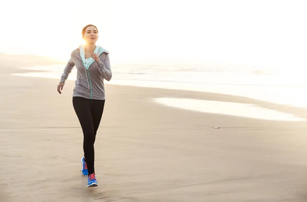 Beautiful woman running — Zdjęcie stockowe