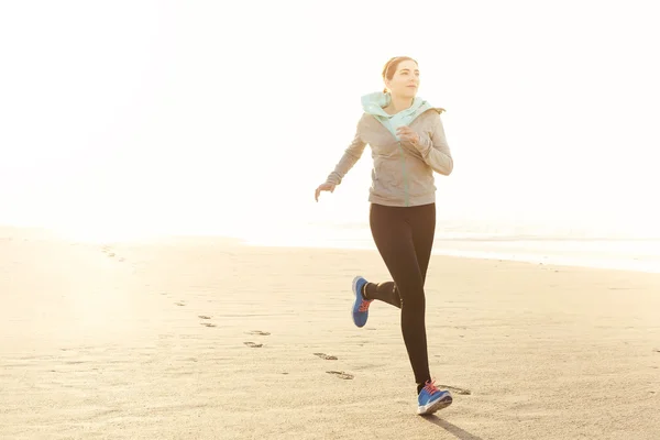 Beautiful woman running — Zdjęcie stockowe