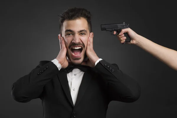 Man yelling with a hand weapon — Stock Photo, Image