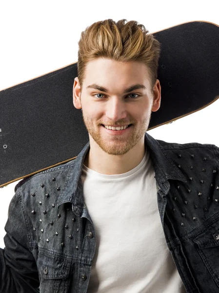 Junger Mann mit Skateboard — Stockfoto