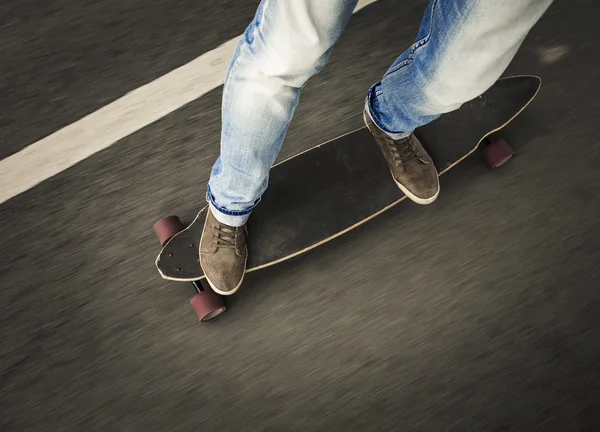 Man feet riding a skateboard