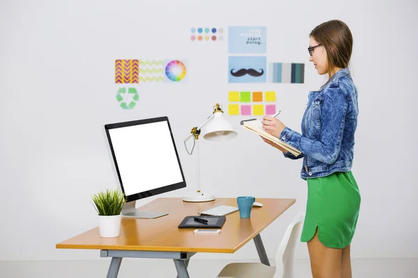 Businesswoman in a creative office — Stock Photo, Image
