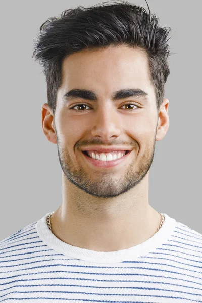 Handsome young man smiling — Stock Photo, Image