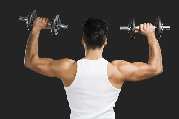 Athletic man lifting weights — Stock Photo, Image