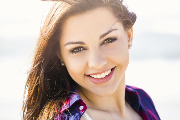 Happy Girl at the beach smiling