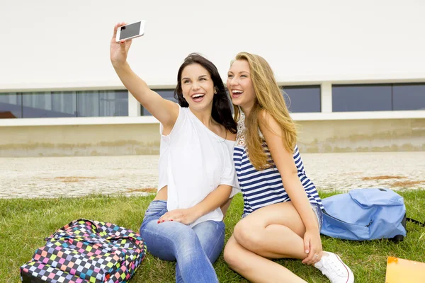 Happy girls making a selfie — Stock Photo, Image