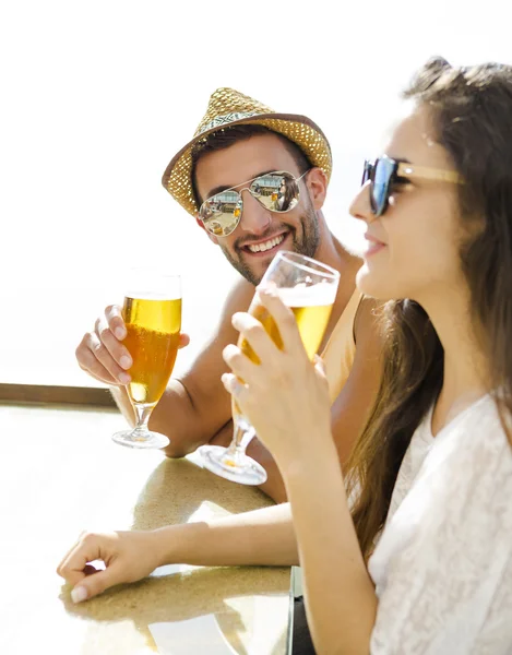 Friends drinking a cold beer — Stock Photo, Image