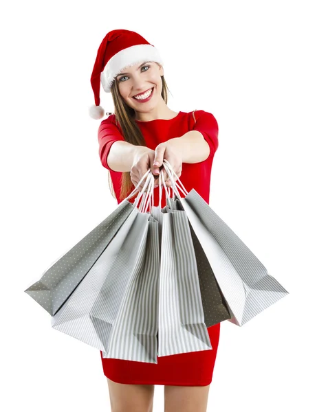 Nő egy santa kalap a bevásárló szatyrok — Stock Fotó