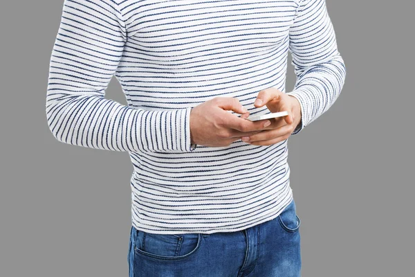 Young man sending a text message — Stock Photo, Image