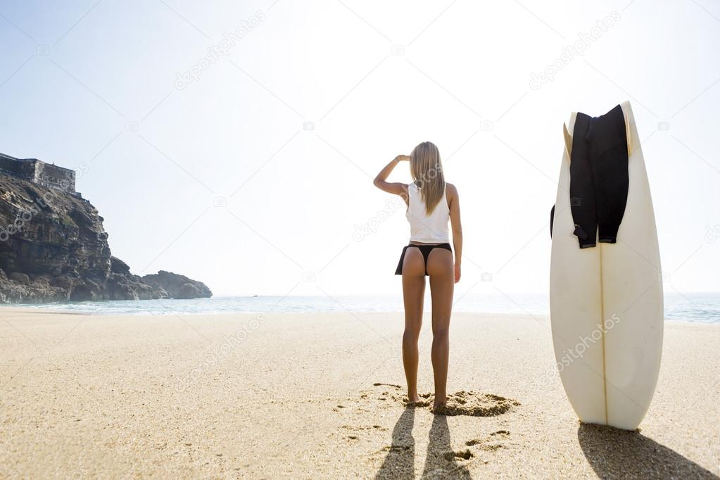 Surfer girl getting ready to surf