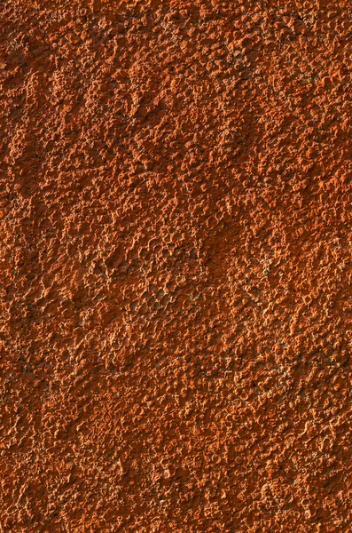 Пластинчатая оранжевая стена с гладкой текстурой — стоковое фото