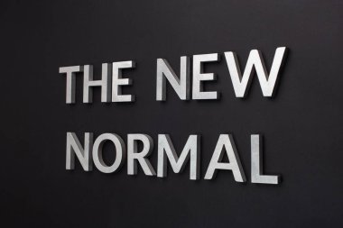words the new normal on black surface in tilted linear perspective clipart