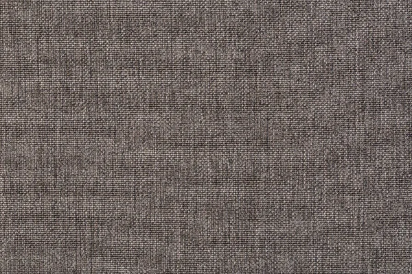 Structure of the ginger cloth with natural texture. Cloth backdrop. The texture of gray fabric textile upholstery of furniture.