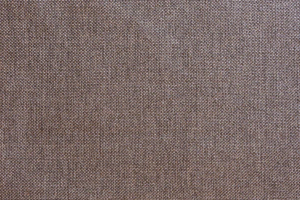 Structure of the ginger cloth with natural texture. Cloth backdrop. The texture of gray fabric textile upholstery of furniture.