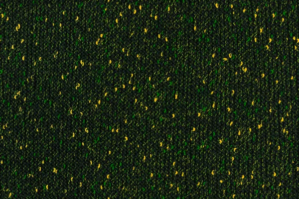 Черный меланж вручную трикотаж ткани с зелеными и желтыми пятнами - бесшовная текстура и плоский фон — стоковое фото