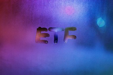 abbreviation word etf - exchange traded funds - handwritten on foggy glass window at night with neon blue back street light clipart