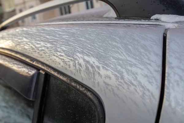 Thin ice frost on silver car surface at morning - close-up with selective focus — Stock Photo, Image