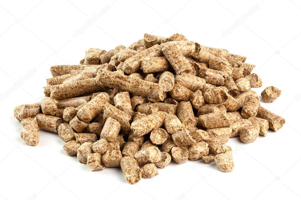 Small pile of pressed wooden sawdust pellets isolated on white background. Biofuel and pet litter, mulch.