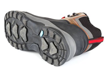 Kahverengi kış sıcaklığı yalıtılmış üç çeyrek spor ayakkabısı ya da beyaz arka planda izole edilmiş bot, yan yatmış.