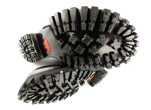 Nahaufnahme Ultra-Weitwinkel-Ansicht der neuen Stiefel Mini Stollen schwarze Gummisohle mit 120 plus Ölbeständigkeit Grad, isoliert auf weiß — Stockfoto