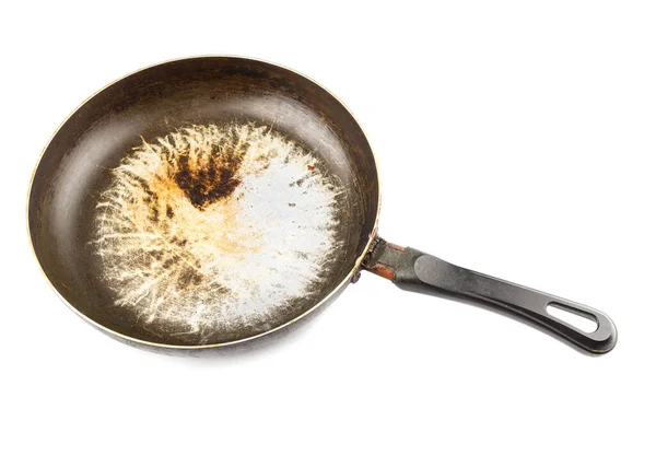 Παλιό λεκιασμένο τηγάνι αλουμινίου με καμένο λίπος και ξεφλουδισμένη αντικολλητική επικάλυψη TFE και απομονωμένο καμένο λίπος — Φωτογραφία Αρχείου