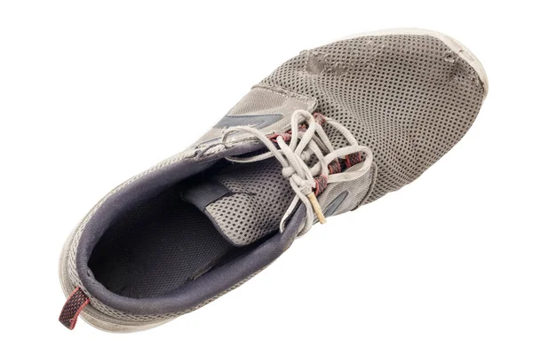 Una zapatilla desgastada aislada sobre fondo blanco —  Fotos de Stock